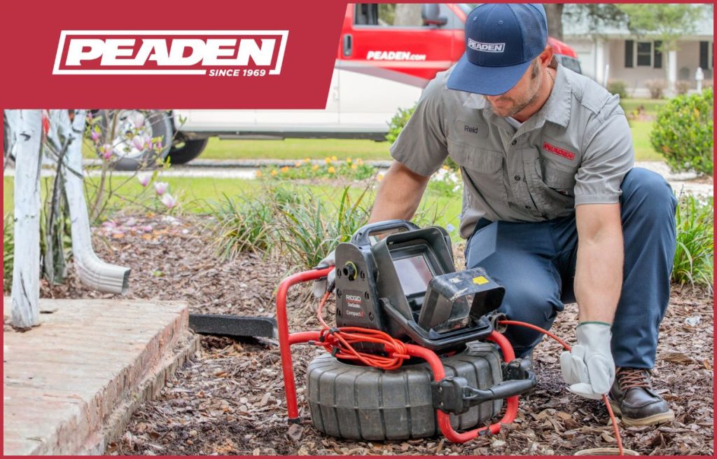 A Peaden plumber using a drain camera.