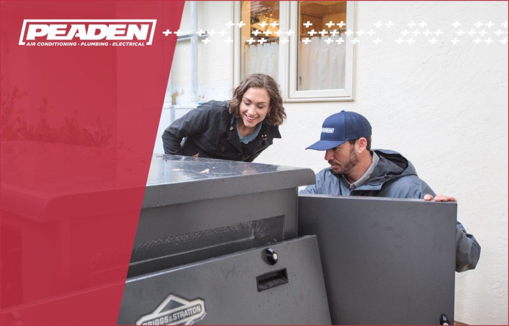 A Peaden Electrician working on a generator with the homeowner looking on.