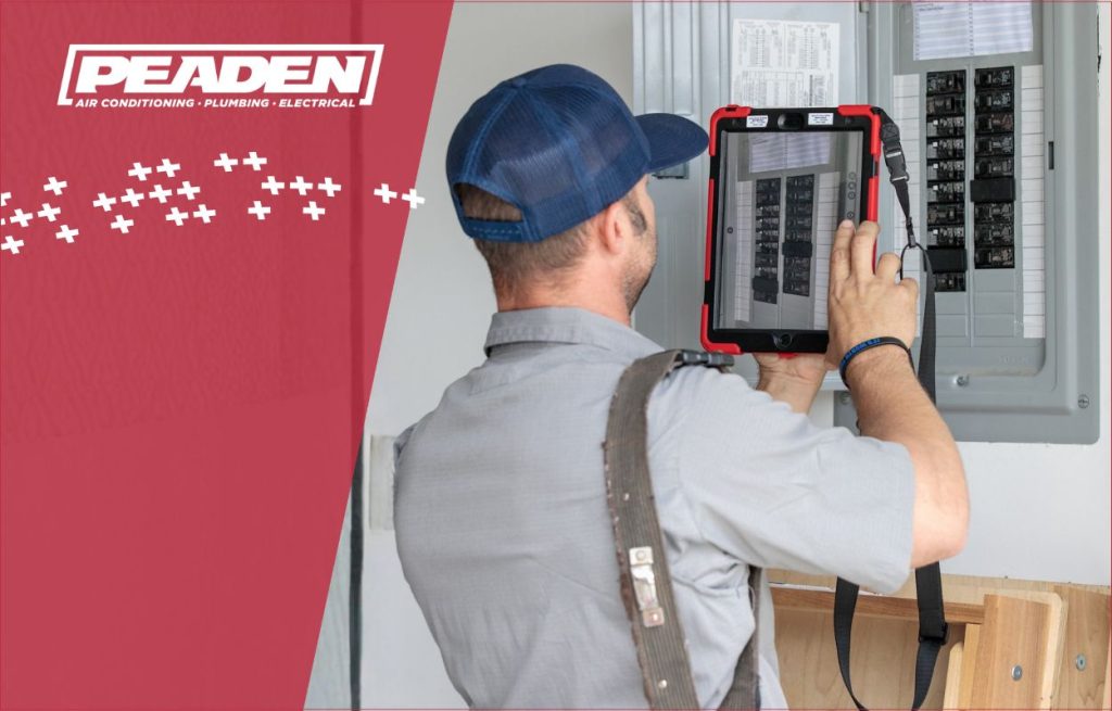 A Peaden Electrician working on a electrical box