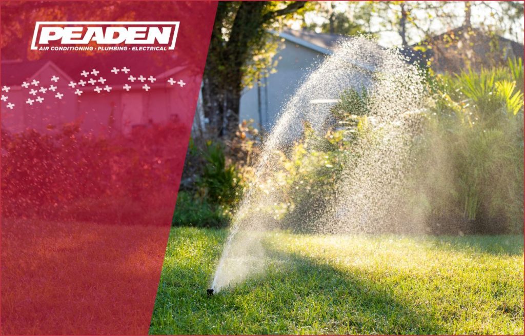 A sprinkler in the yard.