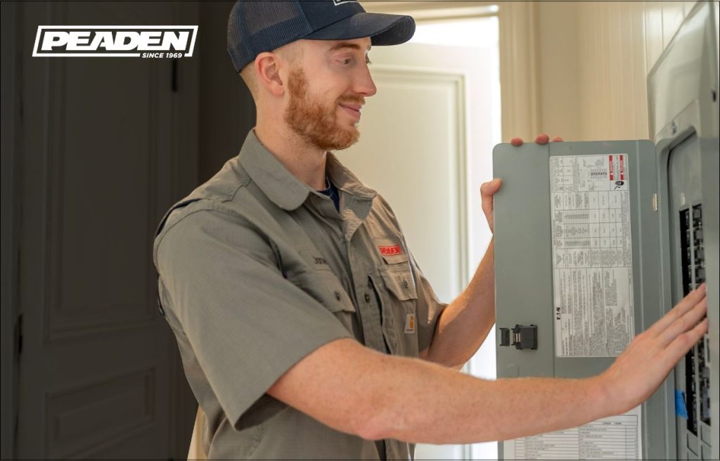 A Peaden Electrician working on a electrical box