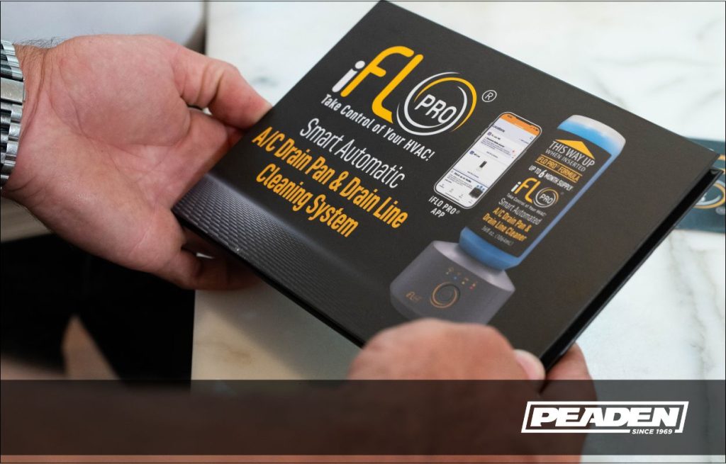 A Peaden HVAC tech showing smart tech
