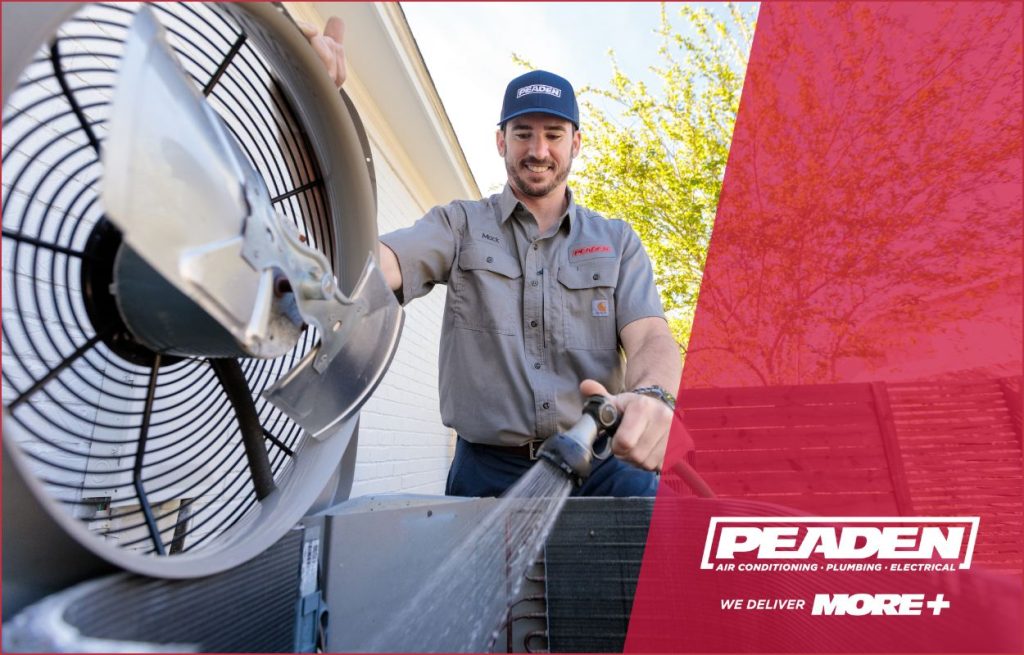 A Peaden HVAC tech working on a AC unit.