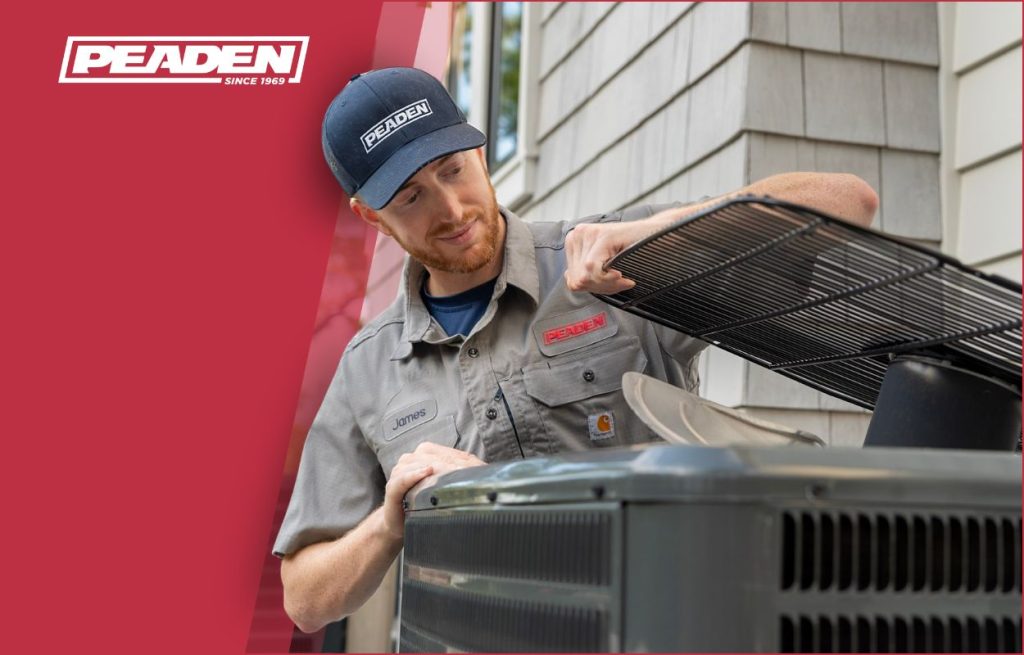 A Peaden HVAC tech working on a AC unit.