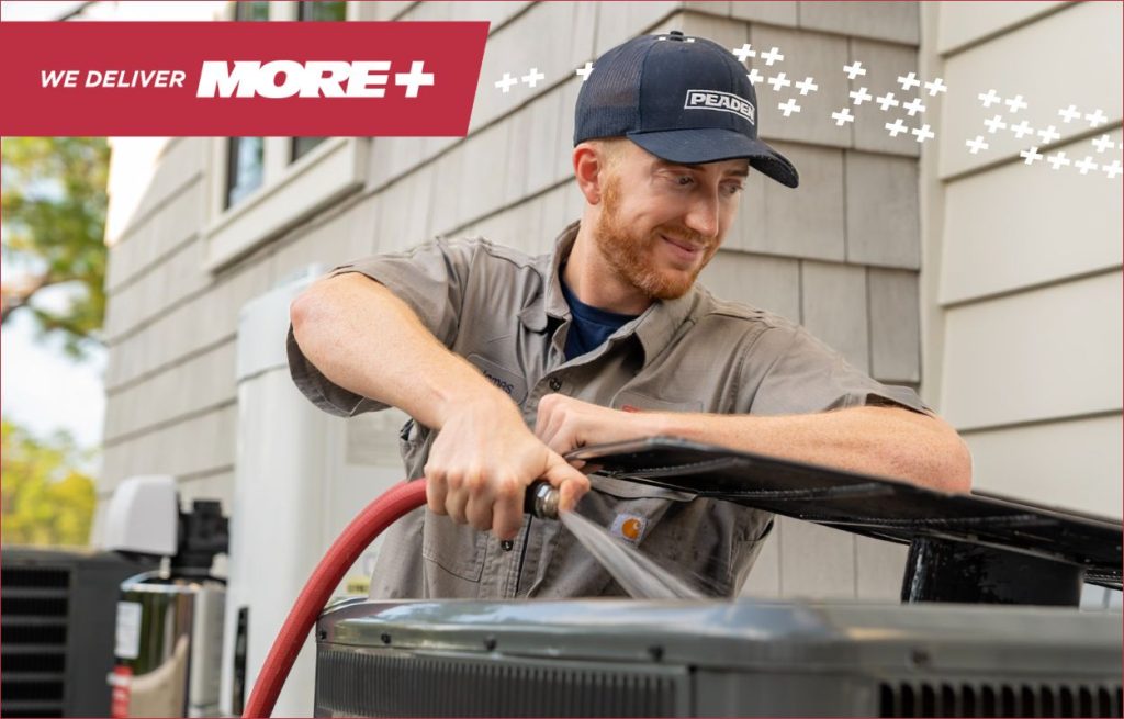 A Peaden HVAC tech working on a AC unit.