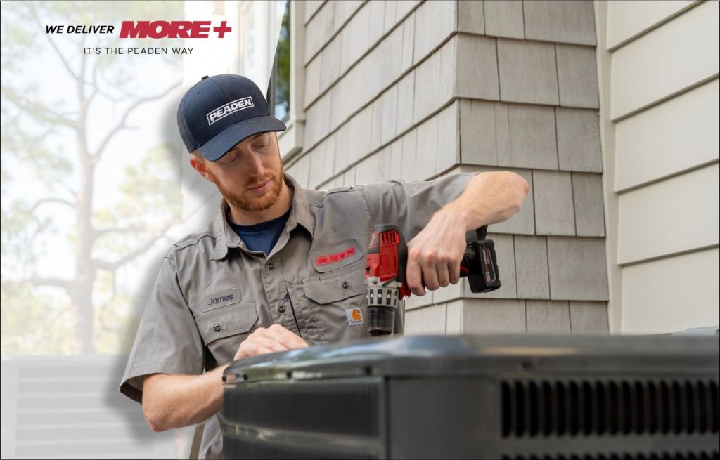 A Peaden HVAC tech working on a AC unit.