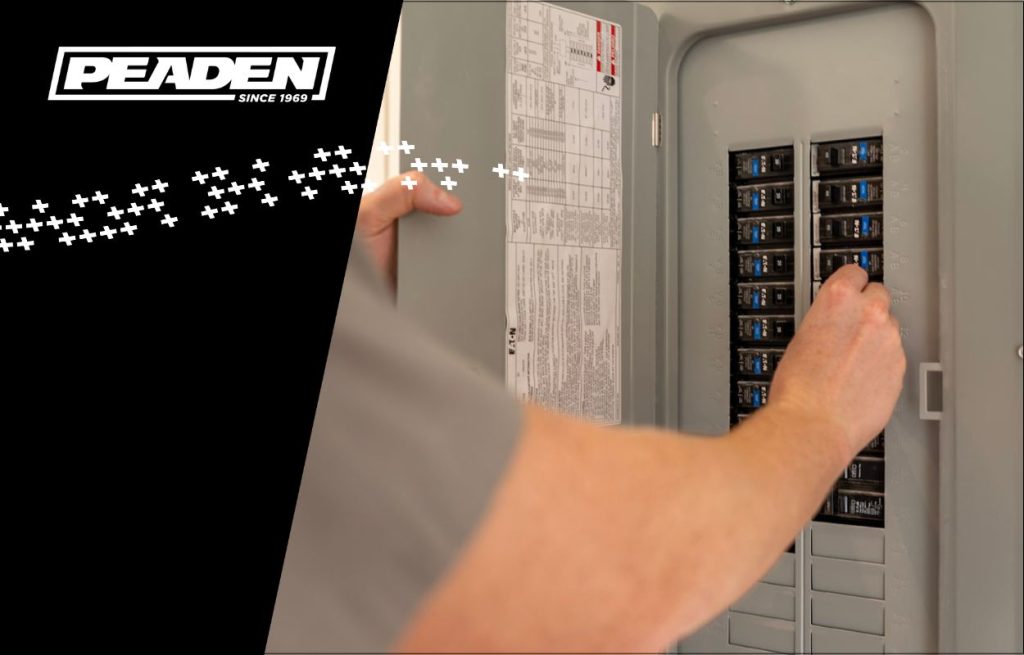 A Peaden Electrician working on a power box