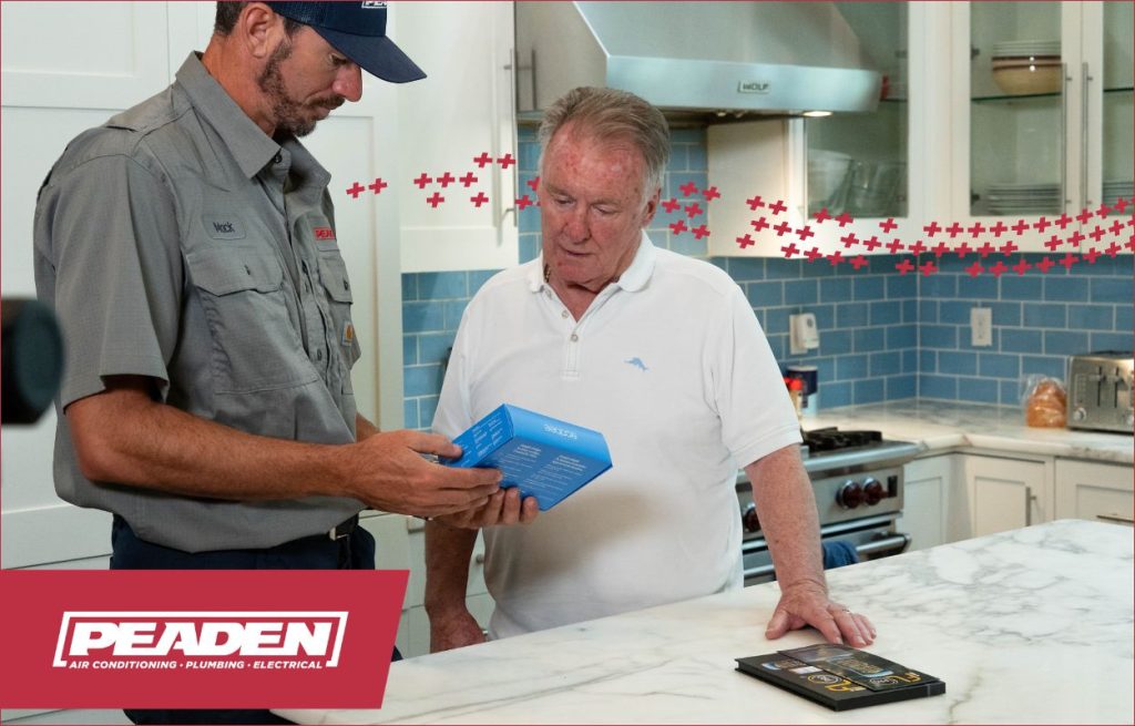 A Peaden HVAC tech discussing Smart tech