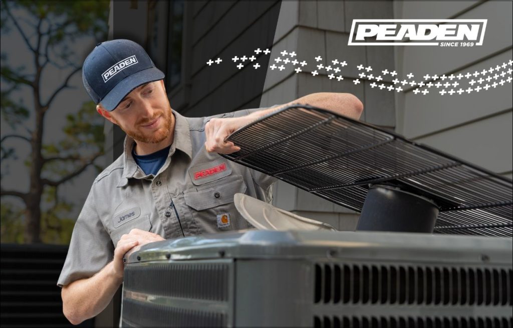 A Peaden HVAC tech working on a AC unit