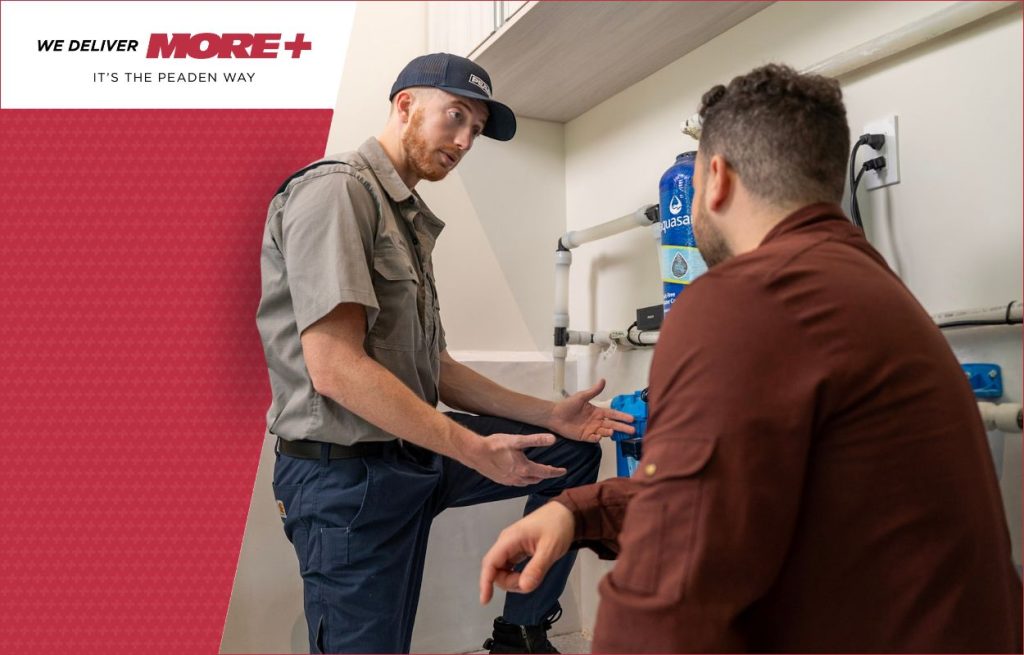 A Peaden plumber explaining low water pressure to a client.