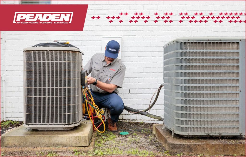 A Peaden HVAC tech working on a AC unit.