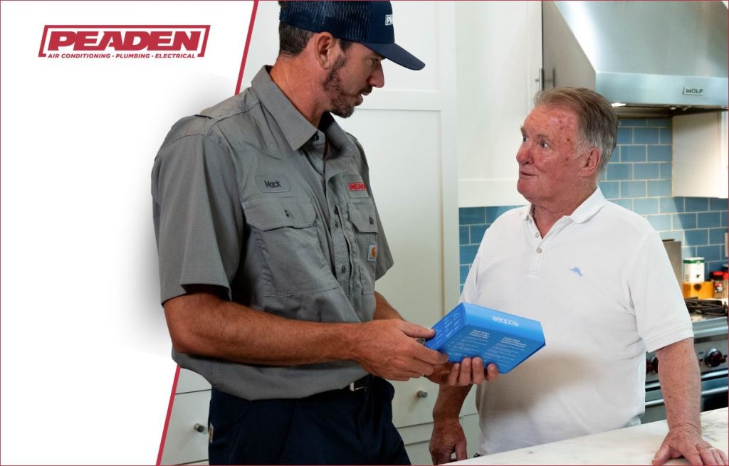 A Peaden HVAC tech explaining about smart tech.