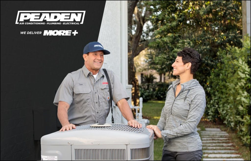 A Peaden HVAC tech talking to a homeowner about AC issues.