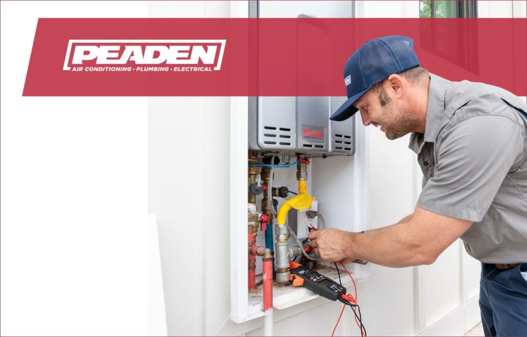 A Peaden plumber installing a tankless water heater.