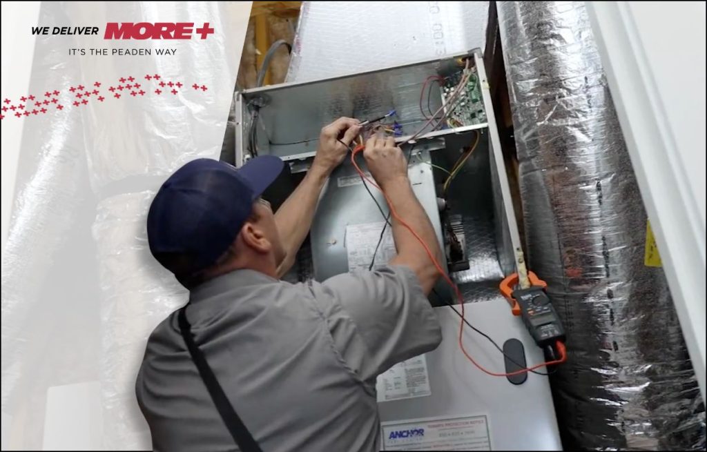 A Peaden HVAC tech working on a air handler