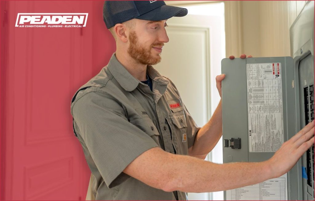 A Peaden Electrician working on a surge protector