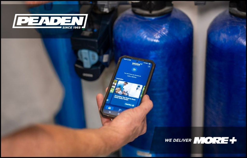 A Peaden plumber using a Flo by Moen app.
