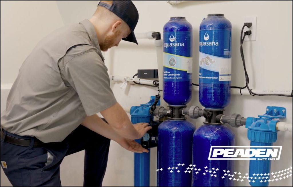 A Peaden plumber installing a Flo by Moen.