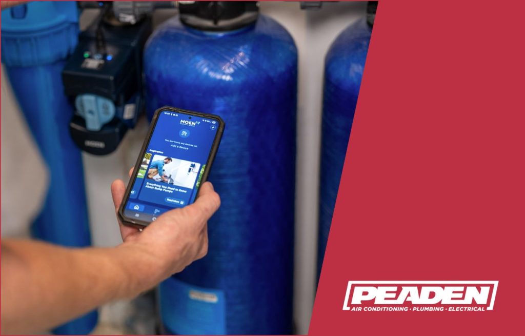 A Peaden plumber using a smart phone to control water treatment.