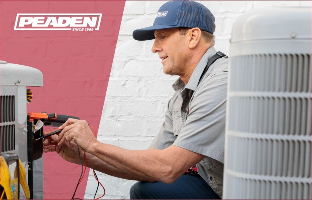 A Peaden HVAC tech working on a AC unit.