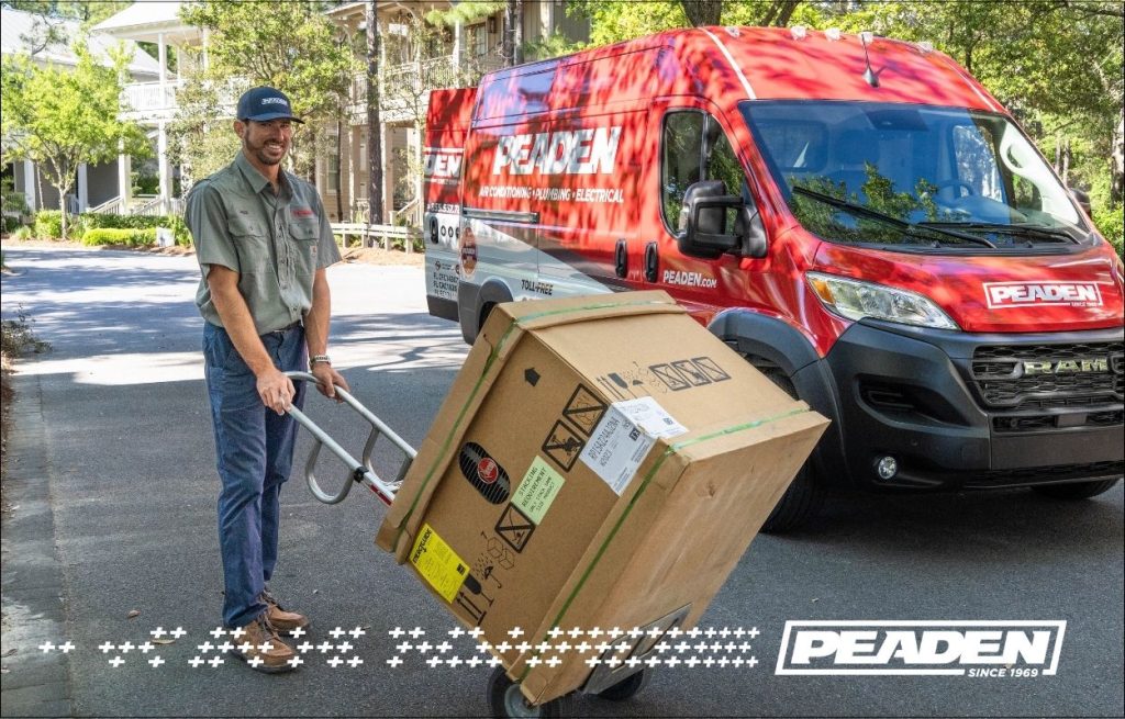 A Peaden HVAC tech delivering a new AC unit.