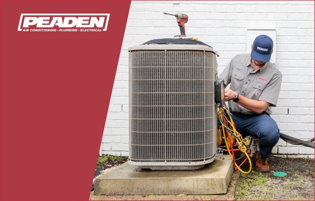 A Peaden HVAC tech working on a AC unit.