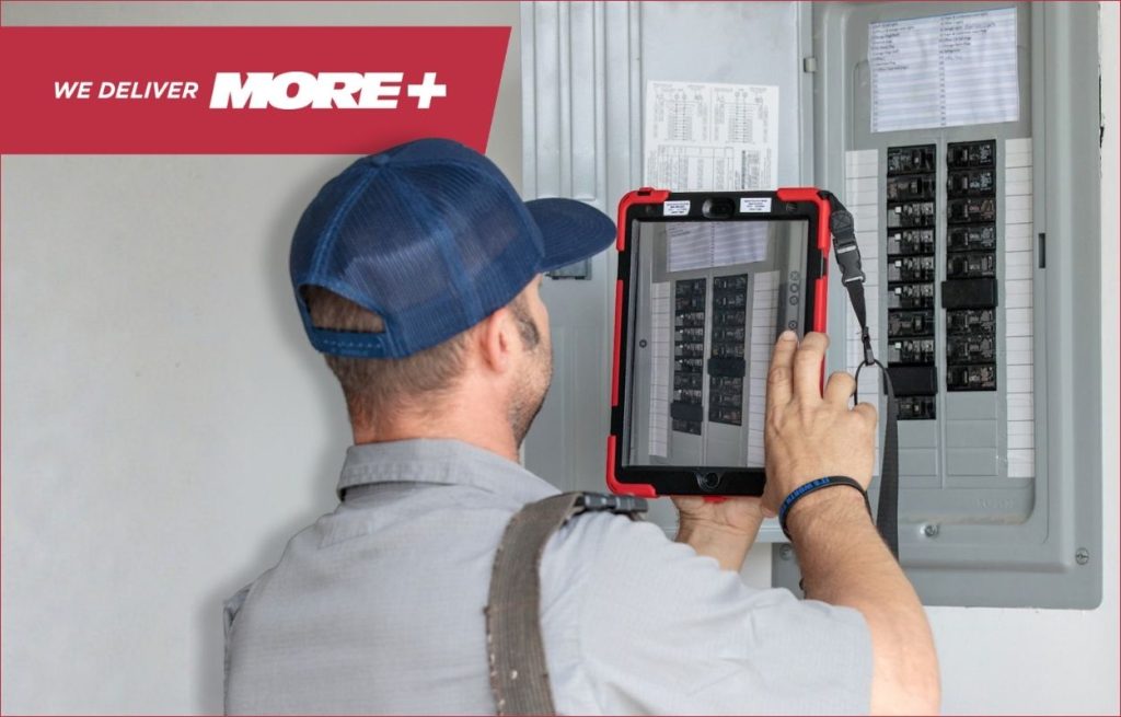 A Peaden Electrician working on a electrical box.