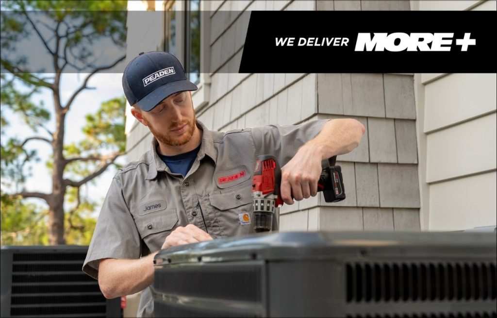 A Peaden HVAC tech working on an AC unit.
