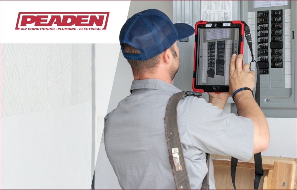 A Peaden Electrician working on a electrical box.