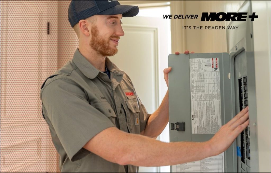 A Peaden Electrician working on a electrical box.