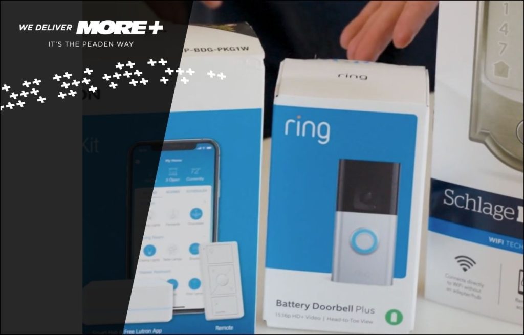 A Peaden Electrician showing a homeownera a new video doorbell.