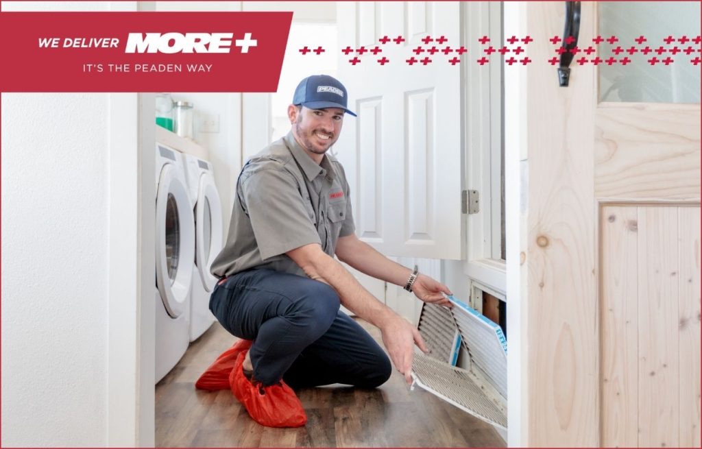 A Peaden HVAC tech changing an air filter