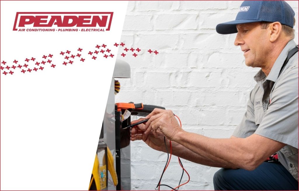 A Peaden HVAC tech working on a AC condenser unit.