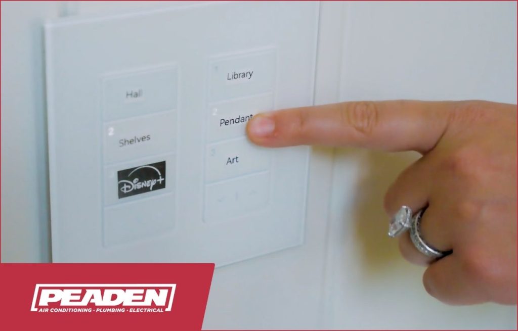 A homeowner using her new smart switch.