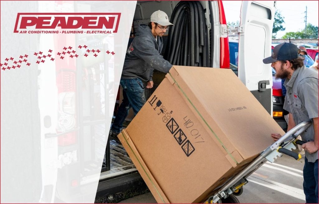 Peaden HVAC techs delivering an new AC unit.