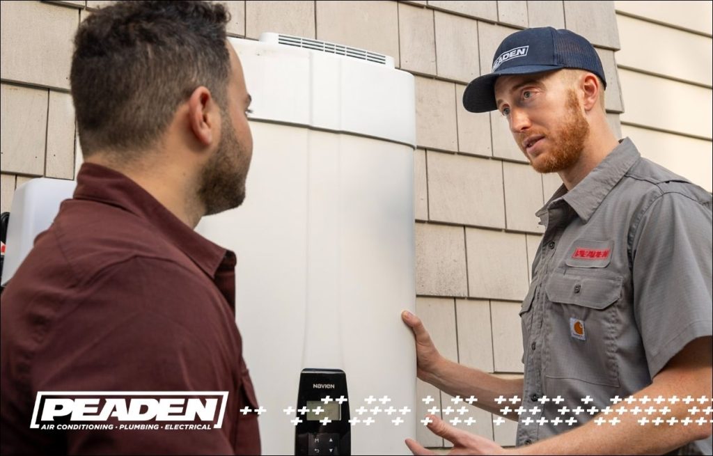 A Peaden plumber explaining sediment buildup in a hot water heater.