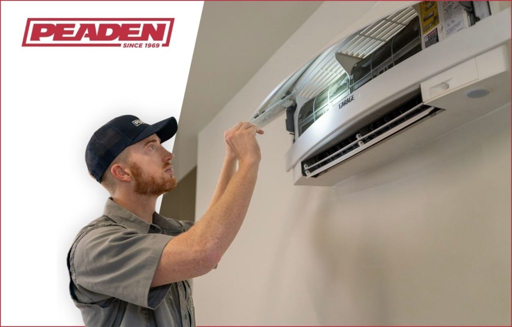 A Peaden HVAC tech working on a mini-split.