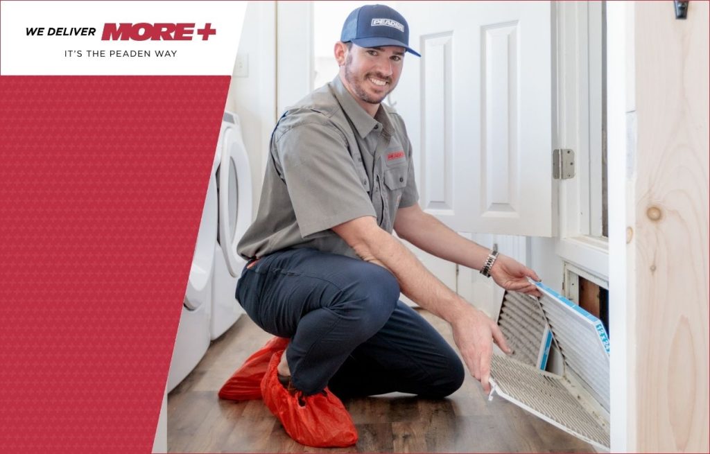 A Peaden HVAC tech changing an air filter