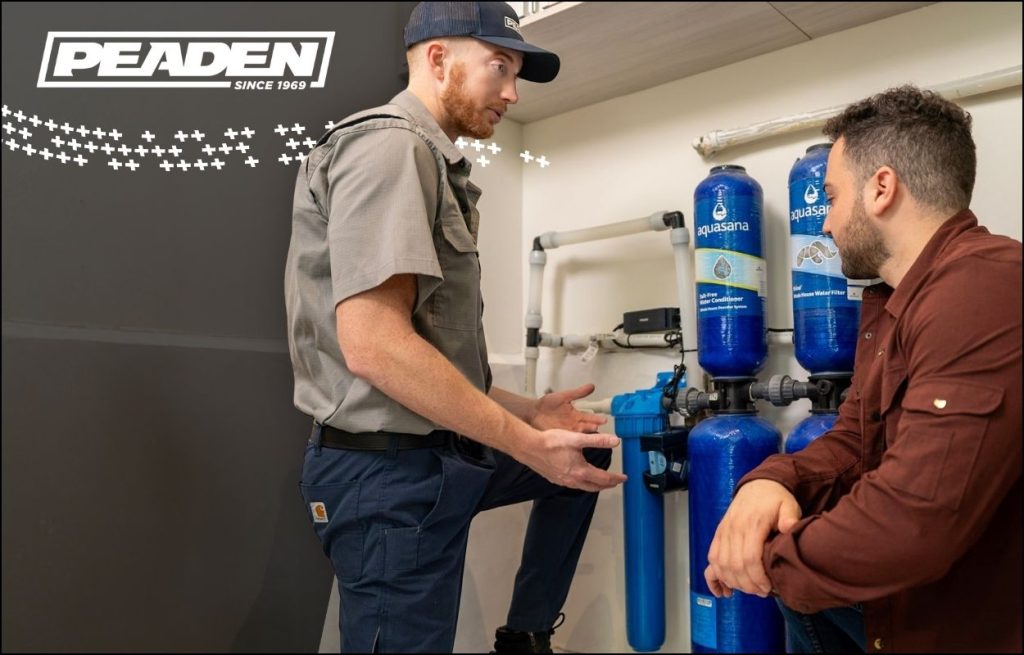 A Peaden plumber explaining water filtration to a client.
