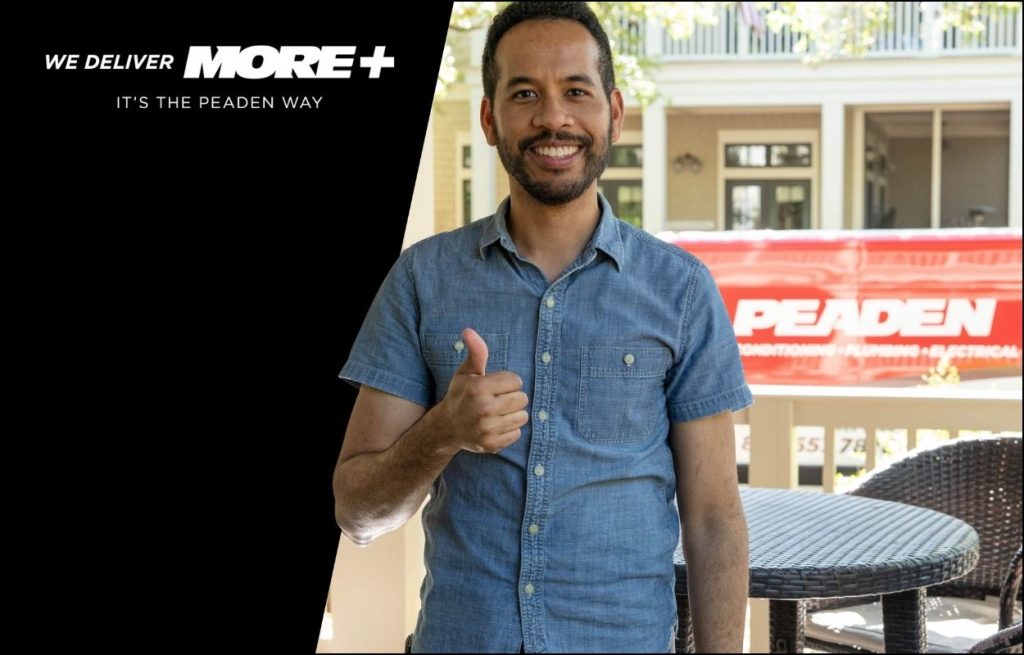 A satisfied Peaden customer giving a thumbs up.