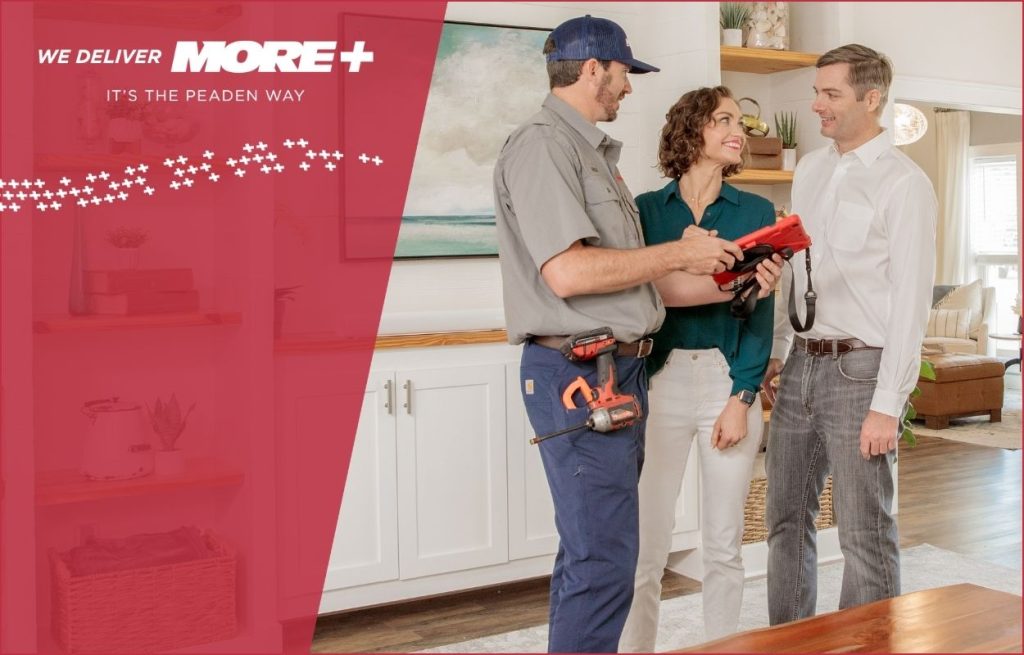 A Peaden HVAC tech discussing whole home service with the home owners.